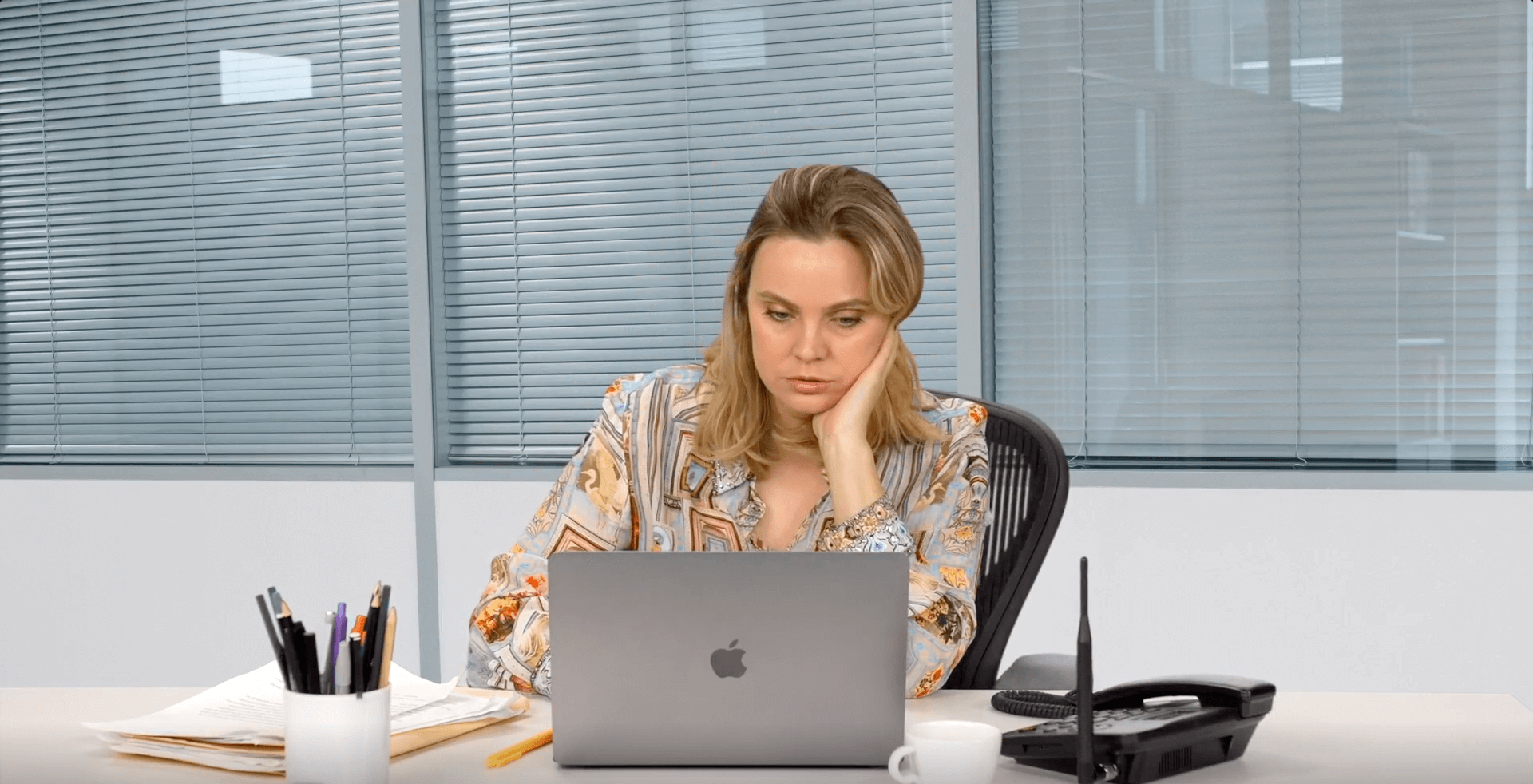 A woman looks over her mental health self care checklist.